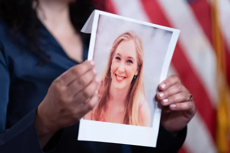 A-person-holds-a-photo-of-Virginia-Giuffre-during-a-press-conference-with-survivors-of-the-abuser-Jeffrey-Epstein-in-the-Capitol-Building-on-Tuesday-February-10-2026-Minority-Leader-Schumer-introduced-Virginias-Law-named-after-late-survivor-Virginia-Giuffre-would-remove-statute-of-limitations-for-civil-cases