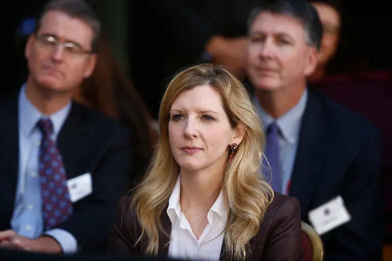 White-House-counsel-Kathryn-Ruemmler-listens-as-President-Barack-Obama-speaks-at-an-installation-ceremony-for-FBI-Director-James-Comey-at-FBI-Headquarters-in-Washington-Monday-Oct-28-2013-Comey-a-former-Bush-administration-official-who-defiantly-refused-to-go-along-with-White-House-demands-on-warrantless-wiretapping-nearly-a-decade-ago-took-over-last-month-for-Robert-Mueller-who-stepped-down-after-12-years-as-agency-director