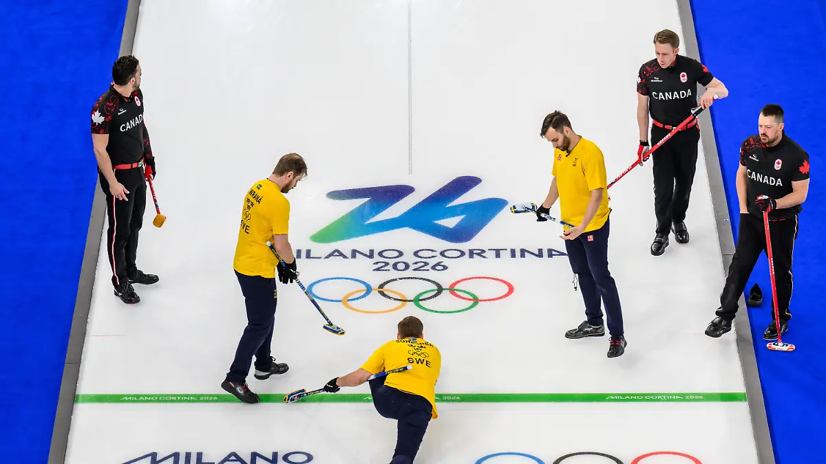 260213-Marc-Kennedy-Ben-Hebert-and-Brett-Gallant-of-Canada-and-Rasmus-Wrana-Christoffer-Sundgren-and-Oskar-Eriksson-of-Sweden-compete-in-a-men-s-round-robin-curling-match-between-Canada-and-Sweden-during-day-7-of-the-2026-Winter-Olympics-on-February-13-2026-in-Cortina