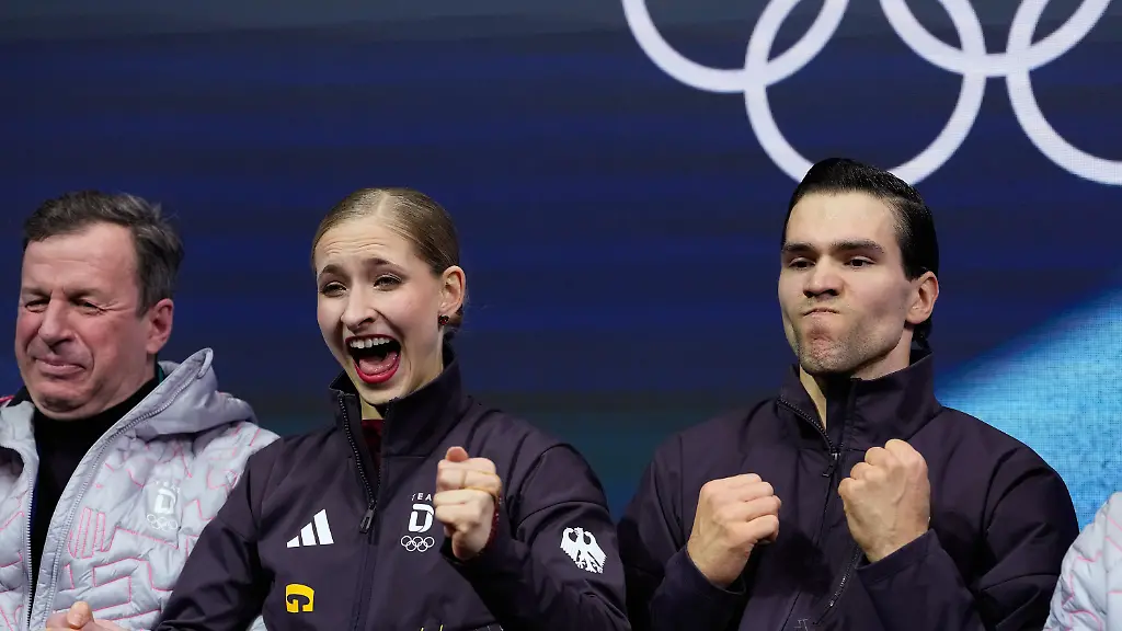 Minerva-Fabienne-Hase-and-Nikita-Volodin-of-Germany-react-to-their-scores-after-competing-during-the-pairs-figure-skating-short-program-at-the-2026-Winter-Olympics-in-Milan-Italy-Sunday-Feb-15-2026
