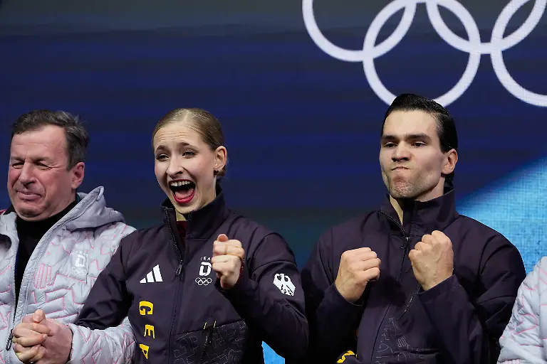 Minerva-Fabienne-Hase-and-Nikita-Volodin-of-Germany-react-to-their-scores-after-competing-during-the-pairs-figure-skating-short-program-at-the-2026-Winter-Olympics-in-Milan-Italy-Sunday-Feb-15-2026