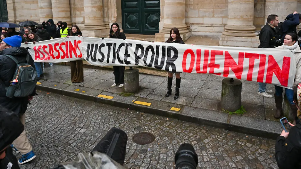 A-banner-reading-Antifas-assassins-Justice-pour-Quentin-during-the-rally-at-Place-de-la-Sorbonne-5th-arrondissement-in-tribute-to-Quentin-D-a-young-identitarian-activist-who-died-after-being-violently-assaulted-in-Lyon-in-Paris-France-on-15-February-2026-Une-banderole-avec-le-message-Antifas-assassins-Justice-pour-Quentin-lors-du-rassemblement-place-de-la-Sorbonne-5e-arrondissement-en-hommage-a-Quentin-D-jeune-militant-identitaire-decede-apres-avoir-ete-violemment-agresse-a-Lyon-a-Paris-France-le-15-fevrier-2026