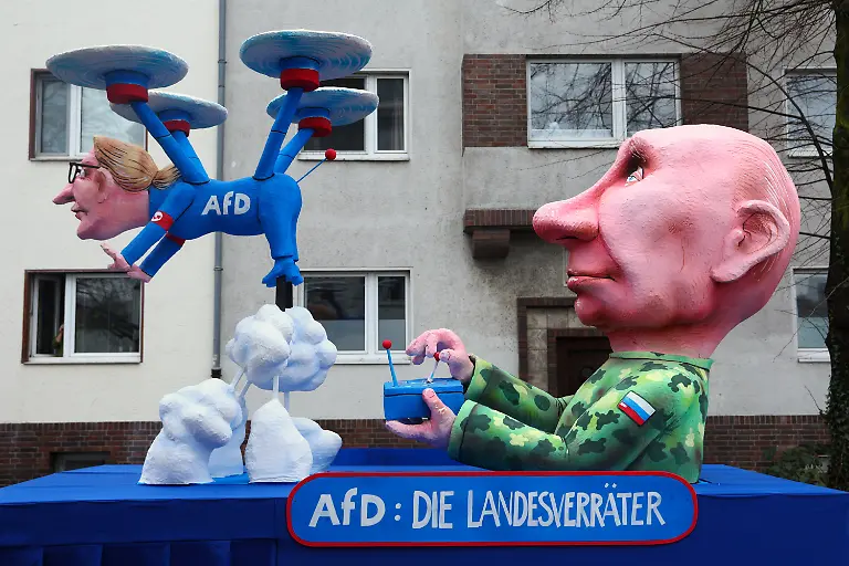A-carnival-float-depicts-Russian-President-Vladimir-Putin-controlling-Alternative-for-Germany-AfD-co-leader-Alice-Weidel-as-a-drone-on-the-day-of-the-traditional-Rosenmontag-Rose-Monday-carnival-parade-in-Duesseldorf-Germany-February-16-2026