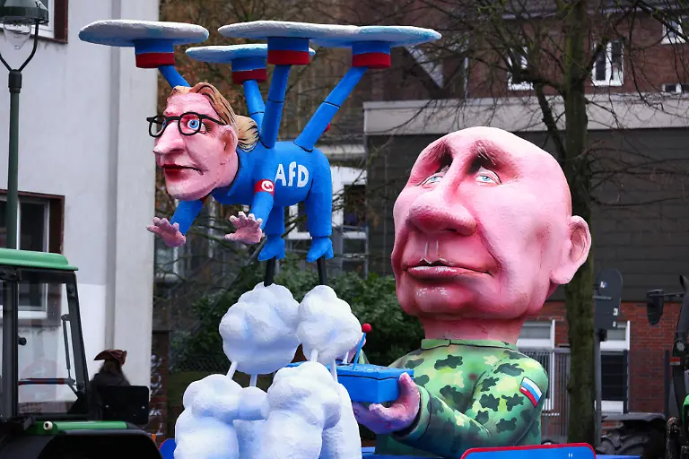 A-carnival-float-depicts-Russian-President-Vladimir-Putin-controlling-Alternative-for-Germany-AfD-co-leader-Alice-Weidel-as-a-drone-on-the-day-of-the-traditional-Rosenmontag-Rose-Monday-carnival-parade-in-Duesseldorf-Germany-February-16-2026