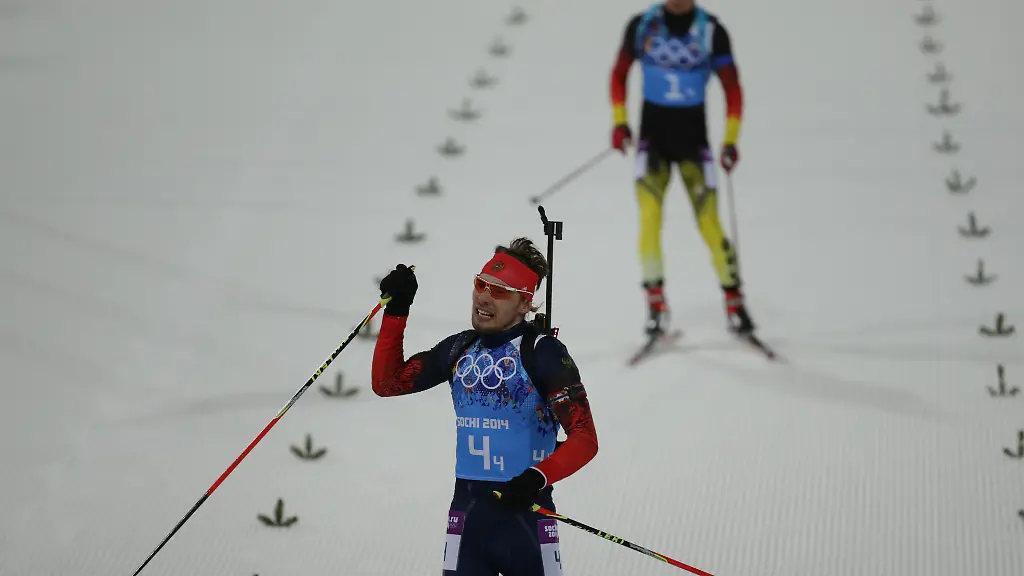 Simon-Schempp-back-of-Germany-and-Anton-Schipulin-of-Russia-in-the-finish-area-of-the-Biathlon-Men-s-4x7-5km-Relay-in-Laura-Cross-country-Ski-Biathlon-Center-at-the-Sochi-2014-Olympic-Games-Krasnaya-Polyana-Russia-22-February-2014