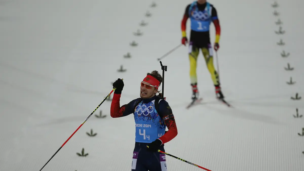 Simon-Schempp-back-of-Germany-and-Anton-Schipulin-of-Russia-in-the-finish-area-of-the-Biathlon-Men-s-4x7-5km-Relay-in-Laura-Cross-country-Ski-Biathlon-Center-at-the-Sochi-2014-Olympic-Games-Krasnaya-Polyana-Russia-22-February-2014