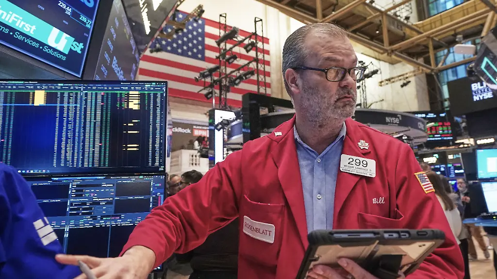 Trader-William-Lawrence-works-on-the-floor-of-the-New-York-Stock-Exchange-Friday-Feb-13-2026-in-New-York