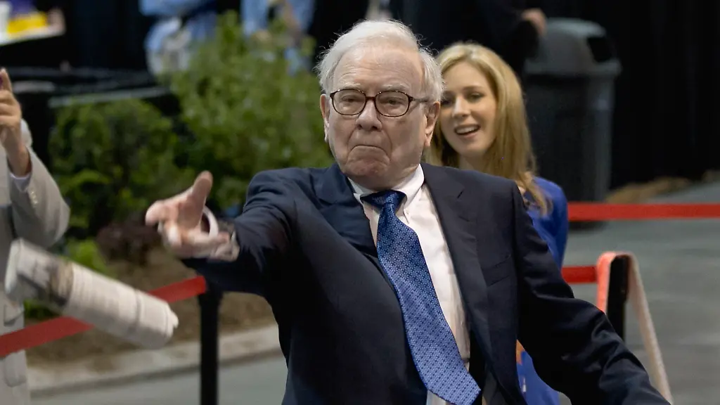 Warren-Buffett-chairman-and-CEO-of-Berkshire-Hathaway-tosses-a-newspaper-during-a-newspaper-tossing-competition-in-Omaha-Neb-Saturday-May-5-2012-Berkshire-Hathaway-is-holding-it-s-annual-shareholders-meeting-this-weekend