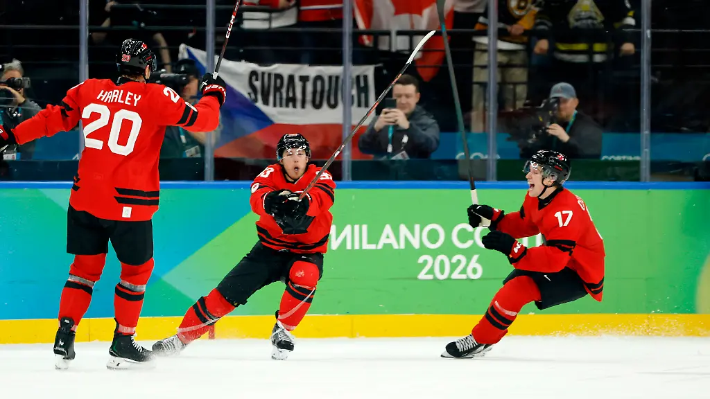 Olympics-Ice-hockey-Eishockey-Men-Quarterfinal-CAN-CZE-Feb-18-2026-Milan-Italy-Mitch-Marner-of-Canada-celebrates-with-Thomas-Harley-and-Macklin-Celebrini-after-scoring-their-fourth-and-game-winning-goal-against-Czechia-in-a-men-s-ice-hockey-quarterfinal-during-the-Milano-Cortina-2026-Olympic-Winter-games-Winterspiele-Spiele-Summer-games-at-Milano-Santagiulia-Ice-Hockey-Arena