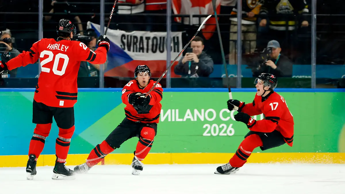 Olympics-Ice-hockey-Eishockey-Men-Quarterfinal-CAN-CZE-Feb-18-2026-Milan-Italy-Mitch-Marner-of-Canada-celebrates-with-Thomas-Harley-and-Macklin-Celebrini-after-scoring-their-fourth-and-game-winning-goal-against-Czechia-in-a-men-s-ice-hockey-quarterfinal-during-the-Milano-Cortina-2026-Olympic-Winter-games-Winterspiele-Spiele-Summer-games-at-Milano-Santagiulia-Ice-Hockey-Arena