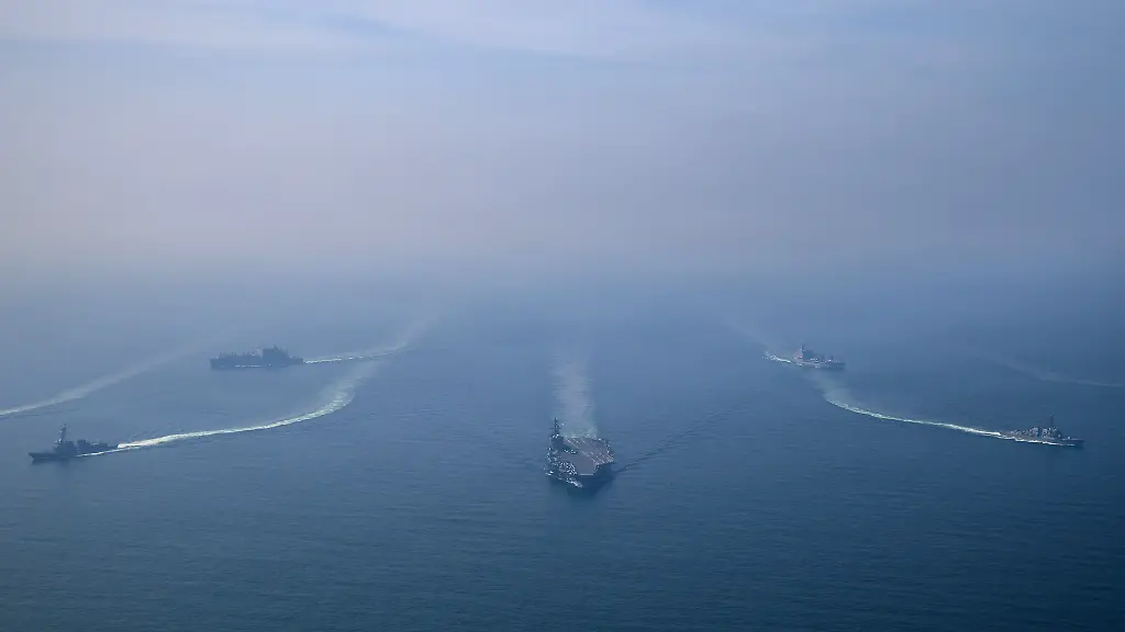 The-U-S-Navy-s-Nimitz-class-aircraft-carrier-USS-Abraham-Lincoln-leads-its-strike-group-during-a-photo-exercise-in-the-Arabian-Sea-February-6-2026-U-S