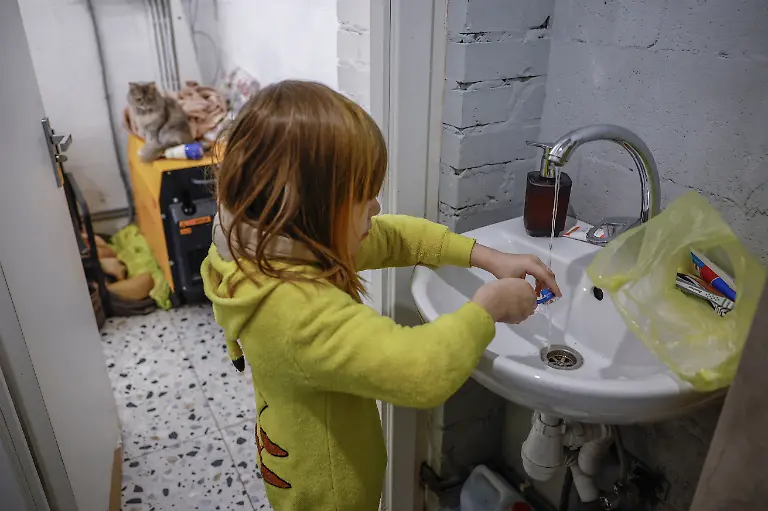 Tymofiy-Davydenko-6-washes-his-toothbrush-in-the-bathroom-of-the-family-s-cafe-where-they-are-staying-because-their-apartment-has-no-heating-or-hot-water-and-faces-frequent-power-outages-amid-Russia-s-attack-on-Ukraine-in-Kyiv-Ukraine-February-2-2026-Waves-of-Russian-attacks-over-the-past-four-months-left-hundreds-of-thousands-without-electricity-and-water-making-this-the-most-devastating-winter-since-the-war-started-for-the-city-s-three-million-people-and-so-the-Davydenko-family-made-the-choice-to-stay-at-the-family-owned-Piggy-Cafe-Kyiv-with-power-supplied-by-a-generator-and-heating-The-point-when-we-decide-to-leave-Kyiv-again-would-be-when-Russian-troops-are-10-12-km-from-the-city-That-s-it-the-mother-Yuliia-Davydenko-40-said-REUTERS-Alina-Smutko-SEARCH-SMUTKO-COLD-FAMILY-FOR-THIS-STORY-SEARCH-WIDER-IMAGE-FOR-ALL-STORIES