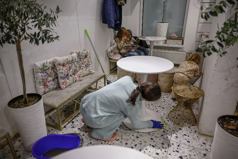 Brothers-Maksym-11-and-Tymofiy-Davydenko-6-play-inside-the-family-cafe-after-their-parents-decided-to-stay-overnight-because-their-apartment-has-no-heating-or-hot-water-and-faces-frequent-power-outages-amid-Russia-s-attack-on-Ukraine-in-Kyiv-Ukraine-February-2-2026-Waves-of-Russian-attacks-over-the-past-four-months-left-hundreds-of-thousands-without-electricity-and-water-making-this-the-most-devastating-winter-since-the-war-started-and-so-the-Davydenko-family-made-the-choice-to-stay-at-the-family-owned-Piggy-Cafe-Kyiv-with-power-supplied-by-a-generator-and-heating-The-point-when-we-decide-to-leave-Kyiv-again-would-be-when-Russian-troops-are-10-12-km-from-the-city-That-s-it-Yuliia-said-REUTERS-Alina-Smutko-SEARCH-SMUTKO-COLD-FAMILY-FOR-THIS-STORY-SEARCH-WIDER-IMAGE-FOR-ALL-STORIES