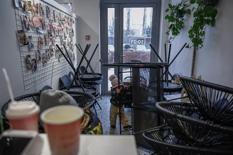 Stephanie-Davydenko-2-plays-inside-the-family-s-cafe-where-they-are-staying-because-their-apartment-has-no-heating-or-hot-water-and-faces-frequent-power-outages-amid-Russia-s-attack-on-Ukraine-in-Kyiv-Ukraine-February-2-2026-Waves-of-Russian-attacks-over-the-past-four-months-left-hundreds-of-thousands-without-electricity-and-water-making-this-the-most-devastating-winter-since-the-war-started-for-the-city-s-three-million-people-and-so-the-Davydenko-family-made-the-choice-to-stay-at-the-family-owned-Piggy-Cafe-Kyiv-with-power-supplied-by-a-generator-and-heating-The-point-when-we-decide-to-leave-Kyiv-again-would-be-when-Russian-troops-are-10-12-km-from-the-city-That-s-it-the-mother-Yuliia-Davydenko-40-said-REUTERS-Alina-Smutko-SEARCH-SMUTKO-COLD-FAMILY-FOR-THIS-STORY-SEARCH-WIDER-IMAGE-FOR-ALL-STORIES