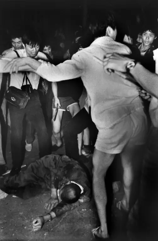 The-driver-of-an-armoured-personnel-carrier-that-rammed-through-student-lines-injuring-many-lies-dead-after-being-beaten-by-students-who-set-his-vehicle-on-fire-during-an-army-attack-on-Tiananmen-Square-in-Beijing-China-June-4-1989