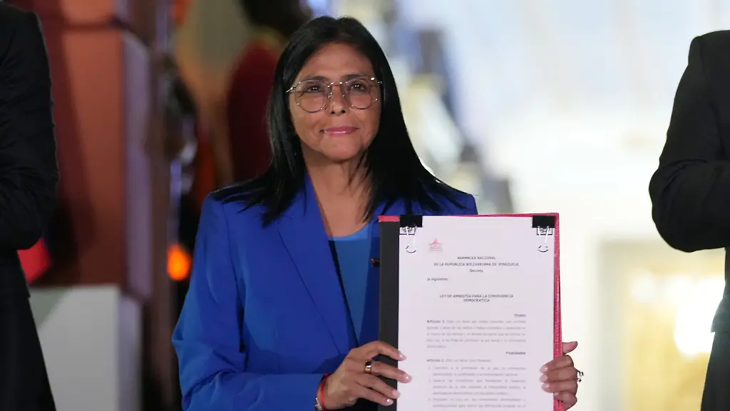 Acting-President-Delcy-Rodriguez-displays-an-amnesty-bill-approved-by-the-National-Assembly-at-Miraflores-Palace-in-Caracas-Venezuela-Thursday-Feb-19-2026