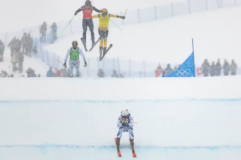 Alex-Fiva-of-Switzerland-bottom-wins-the-heat-in-front-of-Ryan-Regez-of-Switzerland-Satoshi-Furuno-of-Japan-and-Tim-Hronek-of-Germany-from-left-during-the-men-s-Freestyle-Skiing-Ski-Cross-Semifinal-at-the-2026-Olympic-Winter-Games-in-Livigno-Italy-on-Saturday-February-21-2026