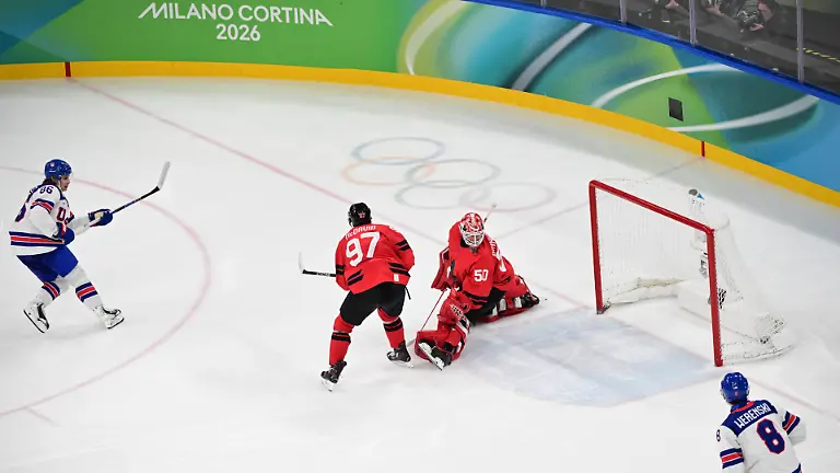 XXV-Winter-Olympic-Games-Olympische-Spiele-Olympia-OS-in-Milan-Italy-on-February-22-2026-Men-s-Ice-hockey-Eishockey-final-Canada-vs-USA-From-left-Jack-Hughes-USA-scores-the-winning-goal-Zach-Werenski-CAN-goalkeeper-Jordan-Binnington-CAN-and-Connor-McDavid-USA
