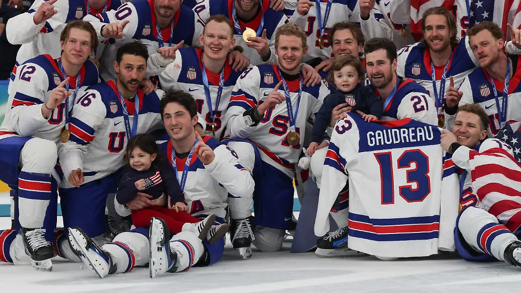 February-22-2026-Team-United-States-poses-with-the-children-of-Johnny-Gaudreau-and-his-number-13-jersey-after-winning-the-Gold-medal-in-the-Mens-Ice-Hockey-Gold-Medal-game-between-Canada-and-USA-held-at-Milano-Santagiulia-Ice-Hockey-Arena-during-the-Milano-Cortina-2026-Olympic-Games-in-Milan-Italy