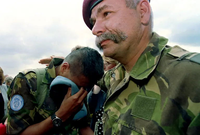 A-Dutch-UN-soldier-cries-out-on-the-shoulder-of-an-officer-at-arrival-on-Soesterberg-military-airbase-July-17
