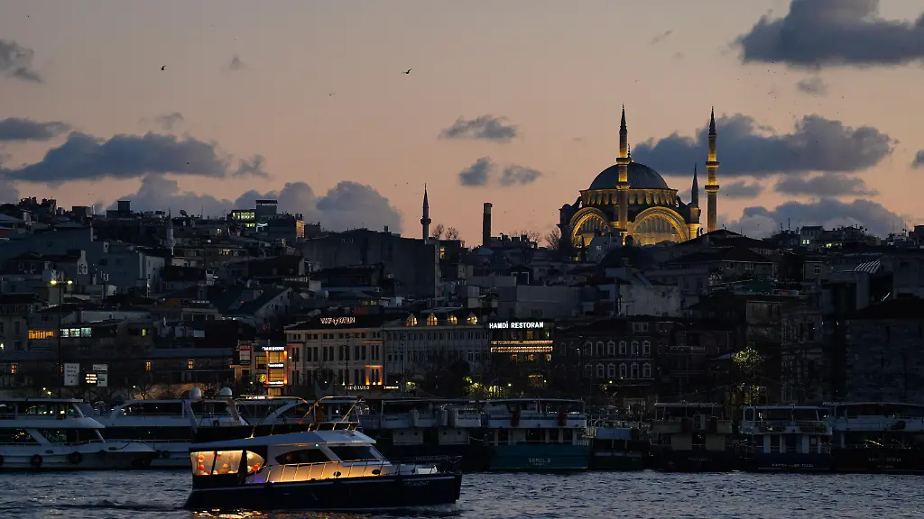 A-vessel-sails-along-the-Bosphorus-Strait-as-the-Ottoman-Al-Noor-Mosque-appears-in-the-background