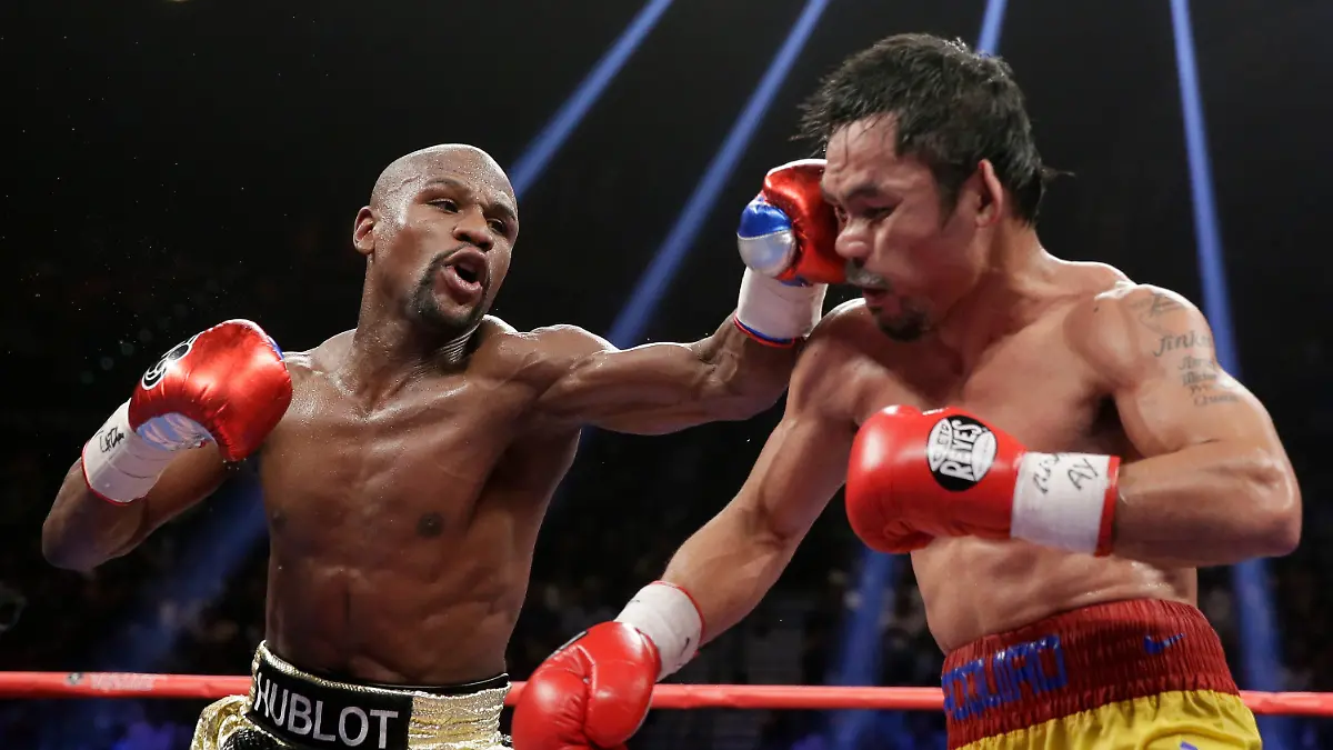 FILE-Floyd-Mayweather-Jr-left-hits-Manny-Pacquiao-from-the-Philippines-during-their-welterweight-title-fight-on-May-2-2015-in-Las-Vegas