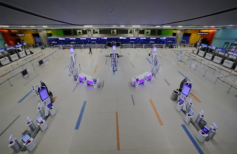 The-JetBlue-terminal-is-empty-as-most-flights-are-cancelled-at-Logan-International-Airport-during-a-winter-blizzard-snow-storm-in-Boston-Massachusetts-U-S-February-23-2026