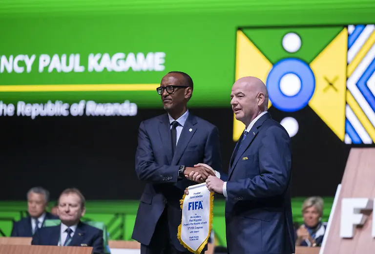 KIGALI-RWANDA-MARCH-16-EDITORIAL-USE-ONLY-Aei-MANDATORY-CREDIT-RWANDAN-PRESIDENCY-HANDOUT-NO-MARKETING-NO-ADVERTISING-CAMPAIGNS-DISTRIBUTED-AS-A-SERVICE-TO-CLIENTS-FIFA-President-Gianni-Infantino-R-gives-a-jersey-to-Rwandan-President-Paul-Kagame-L-during-the-73rd-FIFA-Congress-at-BK-Arena-on-March-16-2023-in-Kigali-Rwanda-on-March-16-2023