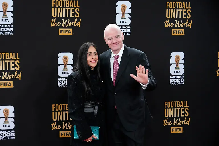 FIFA-President-Gianni-Infantino-and-his-wife-Leena-Al-Ashqar-pose-for-a-photo-as-they-arrive-for-a-welcome-reception-ahead-of-the-draw-for-2026-soccer-World-Cup-at-the-Kennedy-Center-in-Washington-Thursday-Dec-4-2025