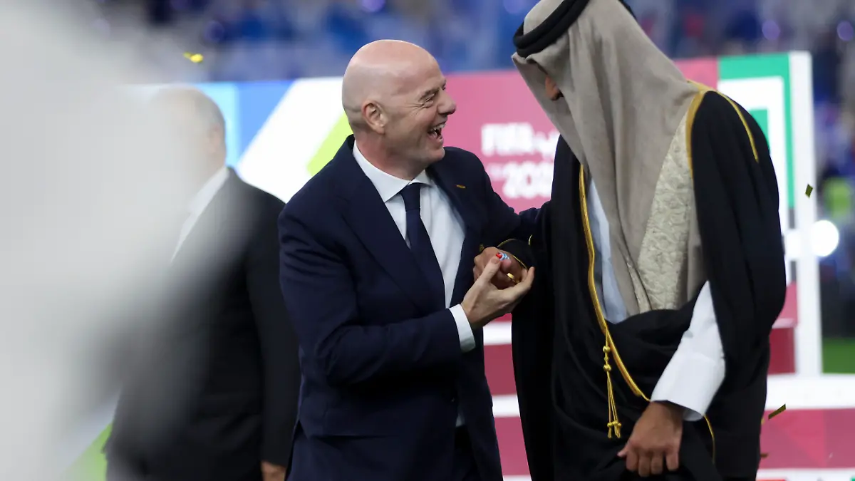 FIFA-president-Gianni-Infantino-and-Emir-of-Qatar-Sheikh-Tamim-bin-Hamad-Al-Thani-stand-on-the-podium-after-the-FIFA-Arab-Cup-2025-final-match-between-Jordan-and-Morocco-at-Lusail-Stadium-in-Doha-Qatar-on-December-18-2025