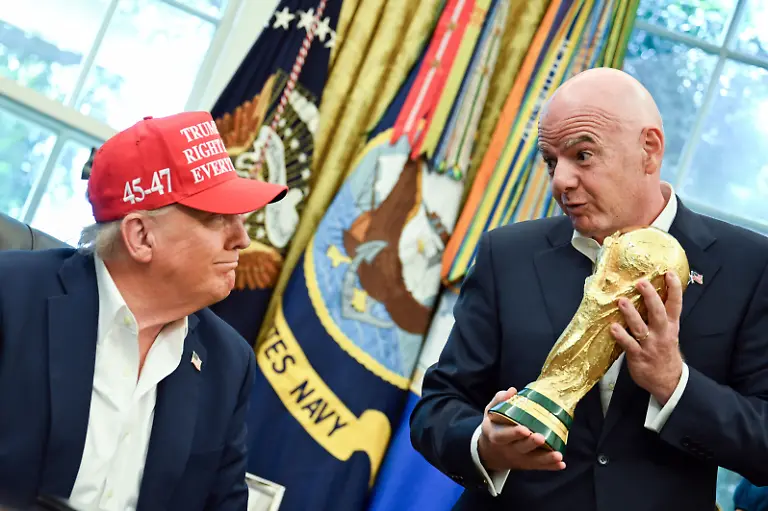 Gianni-Infantino-President-Federation-Internationale-de-Football-Association-FIFA-hands-United-States-President-Donald-J-Trump-the-FIFA-World-Cup-trophy-after-announcing-the-2026-World-Cup-draw-will-be-held-at-the-Kennedy-Center-in-December-in-the-Oval-Office-of-the-White-House-in-Washington-DC-on-Friday-August-22-2025-The-FIFA-World-Cup-coming-to-North-America-next-summer-will-be-the-first-World-Cup-with-three-host-countries-in-the-U-S-Canada-and-Mexico-and-it-will-be-the-first-to-feature-a-48-team-field