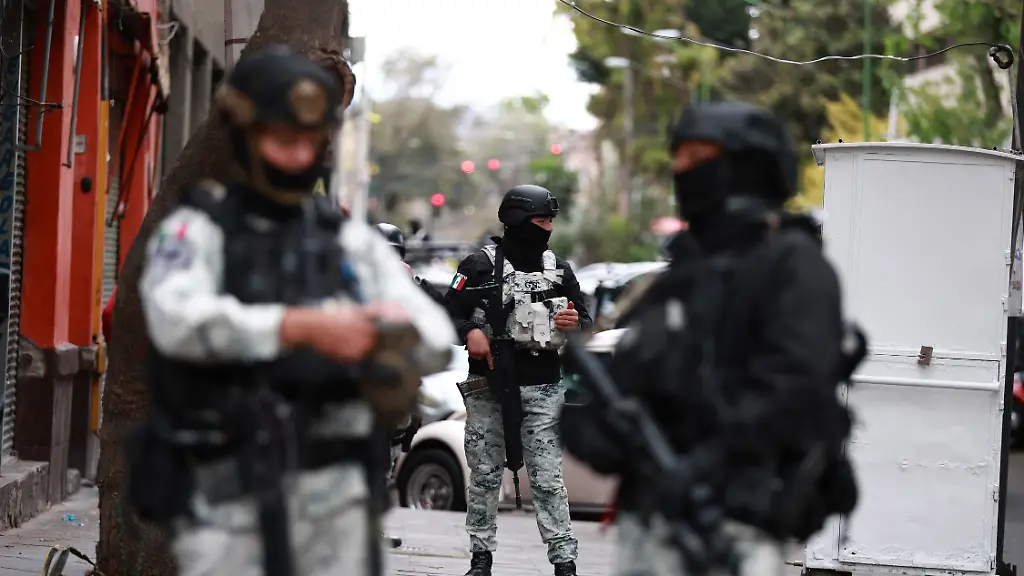 MEXICO-CITY-MEXICO-FEBRUARY-22-Members-of-the-National-Guard-stand-guard-outside-the-facilities-of-the-Specialized-Prosecutor-s-Office-for-Organized-Crime-FEMDO-in-Mexico-City-Mexico-on-February-22-2026-The-security-presence-outside-the-FEMDO-facilities-follows-an-operation-earlier-in-the-day-in-which-cartel-leader-Nemesio-Oseguera-Cervantes-known-as-El-Mencho-was-killed-during-a-military-operation-in-Tapalpa-in-the-state-of-Jalisco-authorities-confirmed