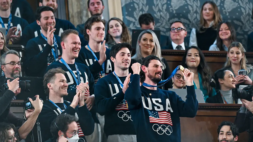 Members-of-the-United-States-Olympic-hockey-team-goalie-Connor-Hellebuyck-in-front-attend-President-Donald-Trump-s-State-of-the-Union-address-to-a-joint-session-of-Congress-in-the-House-chamber-at-the-U-S-Capitol-in-Washington-Tuesday-Feb-24-2026