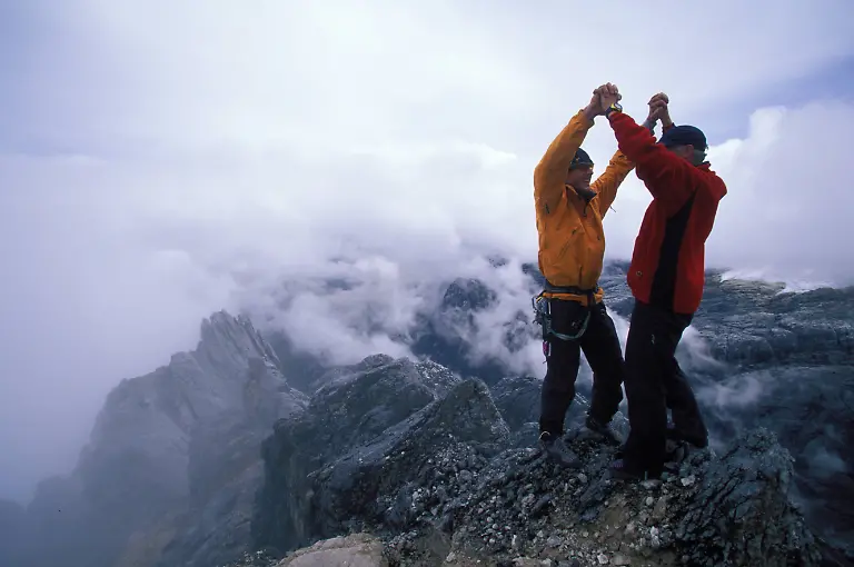 Rob-Milne-and-Stephen-Koch-congratulate-each-other-at-the-top-of-Carstensz-Pyramid-while-on-an-expedition-to-climb-and-snowboard-the-seven-summits-Carstenz-Pyramid-is-the-summit-of-Oceania-Australasia-in-Irian-Jaya-Indonesia