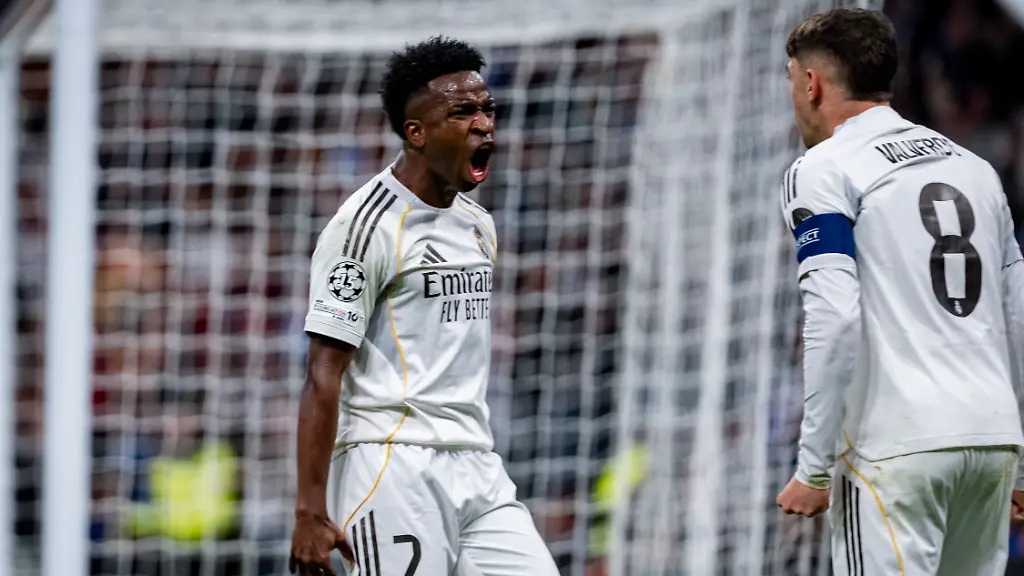 February-25-2026-Madrid-Madrid-Spain-Vinicius-Junior-of-Real-Madrid-L-celebrates-a-goal-with-Federico-Valverde-of-Real-Madrid-R-during-the-UEFA-Champions-League-2025-26-League-Knockout-Play-off-Second-Leg-match-between-Real-Madrid-C-F-and-SL-Benfica-at-Estadio-Santiago-Bernabeu-on-February-25-2026-in-Madrid-Spain