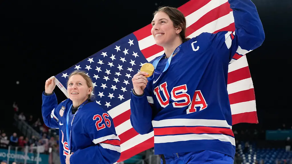 United-States-Kendall-Coyne-left-and-United-States-Hilary-Knight-celebrate-after-victory-ceremony-for-women-s-ice-hockey-at-the-2026-Winter-Olympics-in-Milan-Italy-Thursday-Feb-19-2026