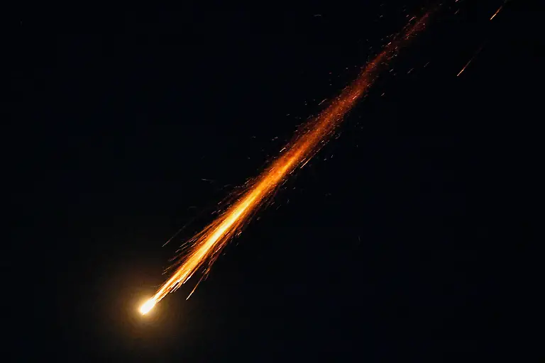 A-fragment-of-a-projectile-falls-from-the-sky-following-an-interception-of-an-Israeli-anti-air-defence-system-after-missiles-were-launched-towards-Israel-from-Iran-following-strikes-by-Israel-and-the-U-S-on-Iran-as-seen-from-Ashkelon-Israel-February-28-2026