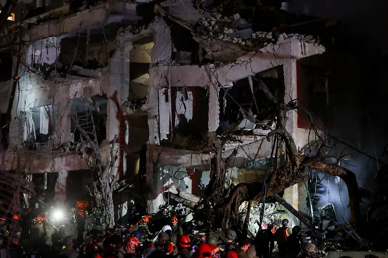 Israeli-emergency-responders-work-at-the-site-of-a-projectile-impact-after-Iran-launched-missiles-into-Israel-following-Israel-and-the-U-S-launching-strikes-on-Iran-in-Tel-Aviv-Israel-February-28-2026