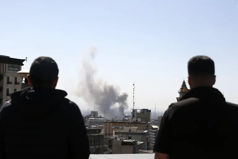 TEHRAN-IRAN-MARCH-01-Plumes-of-smoke-rise-over-the-residential-areas-of-the-Iranian-capital-following-airstrikes-amid-ongoing-U-S-AeiIsrael-attacks-as-multiple-explosions-are-heard-across-the-city-in-Tehran-Iran-on-March-01-2026