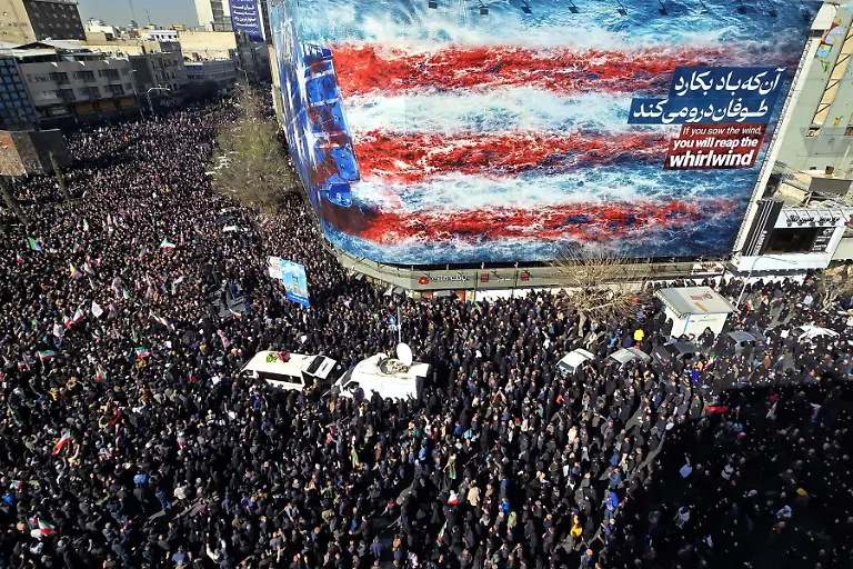 TEHRAN-IRAN-MARCH-01-Demonstrators-wave-Iranian-flags-and-hold-posters-while-chanting-anti-U-S-and-anti-Israel-slogans-during-the-mass-rally-as-they-gather-at-Enghelab-Revolution-Square-in-Tehran-Iran-on-March-01-2026-following-the-announcement-that-Iranian-leader-Ayatollah-Ali-Khamenei-was-killed-in-U-S-AeiIsraeli-attacks