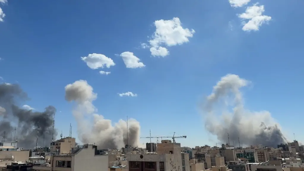 Plumes-of-smoke-rise-after-a-strike-in-Tehran-Iran-Sunday-March-1-2026