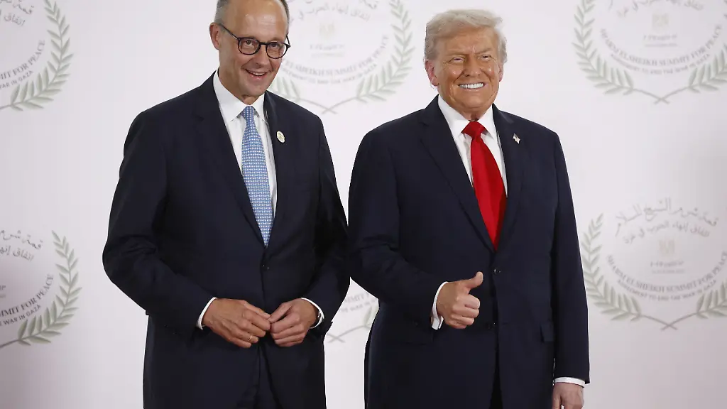 U-S-President-Donald-Trump-and-German-Chancellor-Friedrich-Merz-pose-for-a-photo-at-a-world-leaders-summit-on-ending-the-Gaza-war-amid-a-U-S-brokered-prisoner-hostage-swap-and-ceasefire-deal-between-Israel-and-Hamas-in-Sharm-el-Sheikh-Egypt-October-13-2025