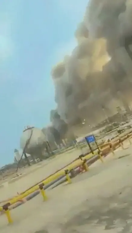 Smoke-rises-at-an-oil-refinery-in-Ras-Tanura-Saudi-Arabia-in-this-still-image-obtained-from-social-media-video-released-on-March-2-2026-Social-Media-via-REUTERS-THIS-IMAGE-HAS-BEEN-SUPPLIED-BY-A-THIRD-PARTY-NO-RESALES-NO-ARCHIVES-NEWS-USE-ONLY-VERIFICATION-Reuters-confirmed-the-location-as-Ras-Tanura-refinery-from-the-Horton-spheres-others-structures-pipes-and-road-layout-seen-in-the-video-which-matched-satellite-imagery-of-the-area-The-date-was-verified-by-official-statement-from-Aramco-saying-they-had-to-shut-the-facility-down-after-a-drone-strike-on-Monday-March-2-No-older-versions-of-the-video-were-found-posted-online-before-Monday-March-2