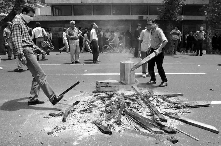 Iranians-protest-in-one-of-Tehran-s-main-streets-13-July-1999-as-the-the-country-s-worst-unrest-since-the-1979-Islamic-Revolution-entered-its-sixth-straight-day-Students-clashed-with-club-weilding-anti-riot-police-and-Islamic-miltiamen-chanting-slogans-in-support-of-Iran-s-reformist-President-Mohammad-Khatami-despite-a-government-ban-on-demostrations-declared-late-12-July-1999