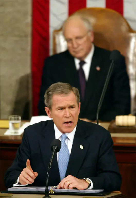 FILE-In-this-Jan-29-2002-file-photo-President-George-W-Bush-gives-his-State-of-the-Union-address-on-Capitol-Hill-in-Washington-during-which-he-grouped-Iran-Iraq-and-North-Korea-together-as-the-West-s-most-dangerous-foe-and-called-them-an-axis-of-evil-The-painful-legacy-of-the-Iraq-war-has-complicated-President-Barack-Obamas-efforts-to-muster-support-for-a-military-strike-against-Syria-As-a-senator-Obama-opposed-it-and-as-president-he-brought-it-to-a-close-But-the-Iraq-Wars-end-has-not-erased-memories-of-the-false-premise-upon-which-Bush-built-a-case-for-the-U-S-led-bombing-campaign-and-ground-invasion
