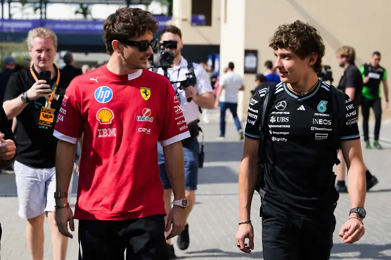Charles-Leclerc-of-the-Scuderia-Ferrari-HP-F1-Team-and-Andrea-Kimi-Antonelli-driver-of-the-Mercedes-F1-Team-participate-in-Race-Day-on-Yas-Island-Abu-Dhabi-on-December-7-2025