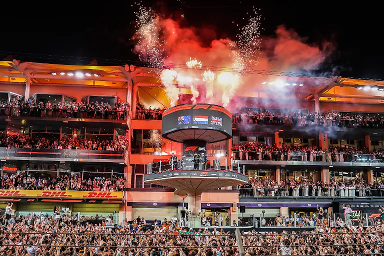 F1-World-Drivers-Champion-and-Third-placed-Lando-Norris-of-McLaren-celebrates-on-the-podium-during-fireworks-after-Formula-1-Abu-Dhabi-Grand-Prix-at-Yas-Marina-Circuit-on-December-7th-2025-in-Abu-Dhabi-United-Arab-Emirates