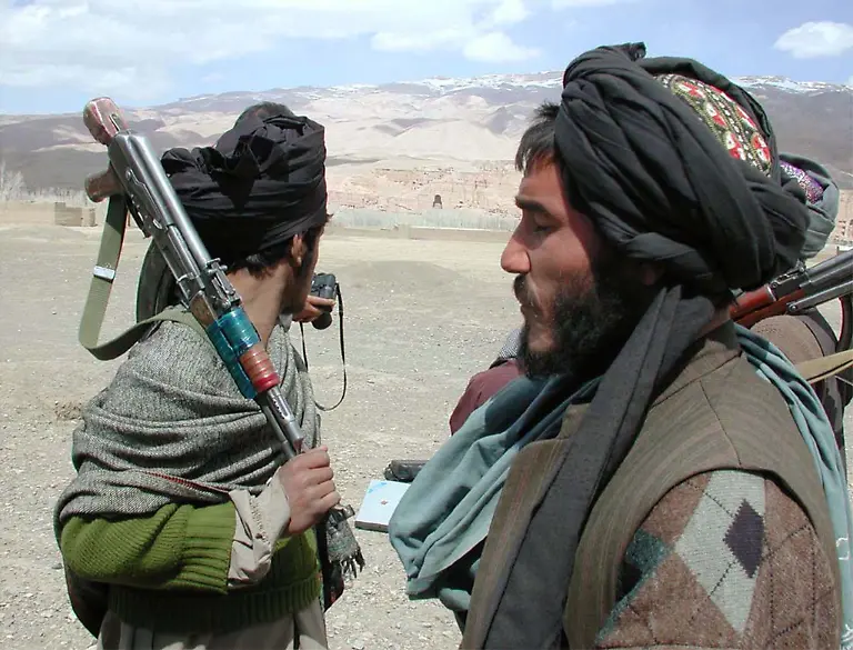 A-fighter-of-the-Afghan-ruling-Taliban-looks-towards-the-cliff-of-the-destroyed-Buddha-statue-in-the-central-Afghan-province-of-Bamiyan-on-March-26-2001-Afghanistan-s-ruling-Taliban-needed-20-days-to-destroy-two-giant-Buddhas-hewn-into-a-cliff-more-than-1-500-years-ago-an-official-said-on-Monday