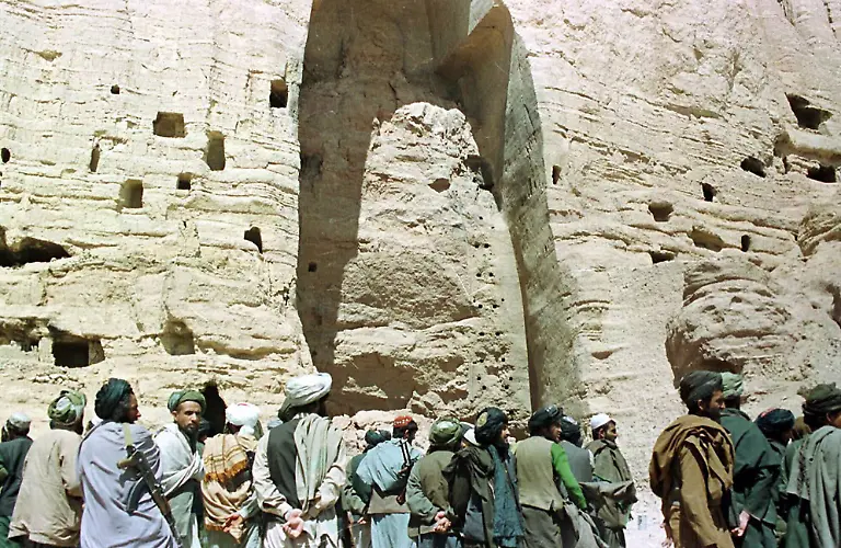 FILE-In-this-March-26-2001-file-photo-Taliban-soldiers-stand-at-the-base-of-the-mountain-alcove-where-the-world-s-tallest-Buddha-statue-once-stood-up-to-180-feet-high-in-Bamiyan-Afghanistan-German-scientists-say-it-is-possible-to-reconstruct-at-least-one-of-the-giant-1-500-year-old-Buddha-statues-in-central-Afghanistan-that-had-been-dynamited-by-the-Taliban-ten-years-ago-despite-a-worldwide-outcry-Erwin-Emmerling-of-Munich-s-Technical-University-said-Monday-Feb-28-2011-his-researchers-studied-several-hundred-fragments-of-the-statues-that-once-towered-up-to-180-feet-high-in-Bamiyan-province