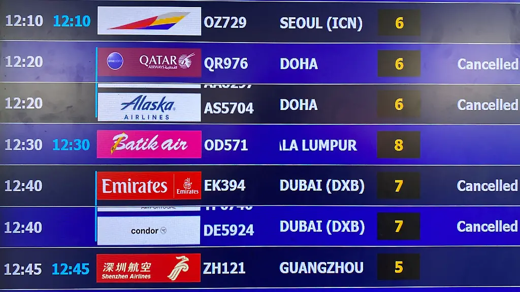 A-display-board-shows-canceled-flights-to-Dubai-and-Doha-amid-regional-airspace-closures-at-Noi-Bai-International-Airport-amid-the-U-S-Israel-conflict-with-Iran-in-Hanoi-Vietnam-March-2-2026-Picture-taken-with-a-mobile-phone